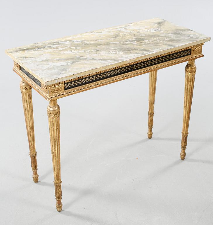 A late Gustavian table , around the year 1800.