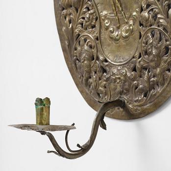 A set of four Swedish Baroque repoussé silvered brass reflector one-branch reflector plates, ca 1690-1700.