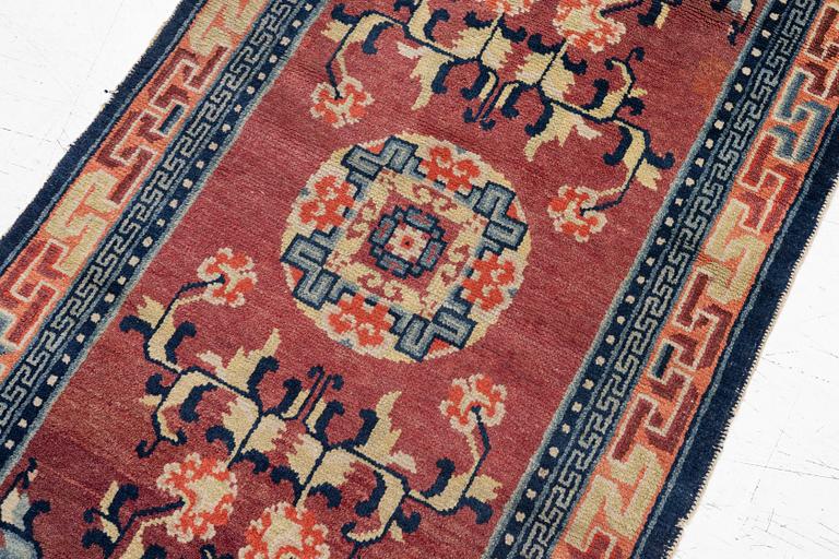 Carpet, antique China, approx. 128 x 67 cm.
