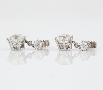 A pair of cushion-cut diamond earrings. Total carat weight of diamonds circa 7.80 cts.