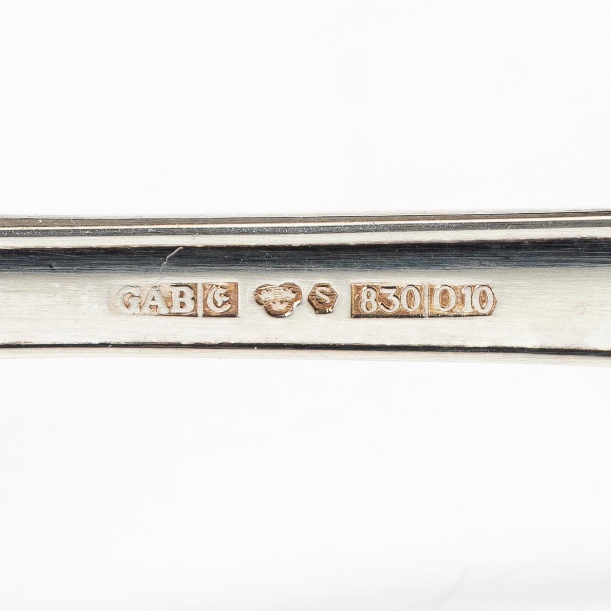 Salad servers, a pair, and six napkin rings, silver, second half of the 20th Century.