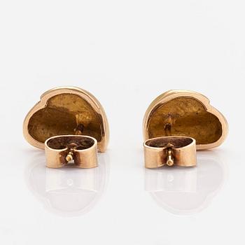 A pair of 14K gold earrings.