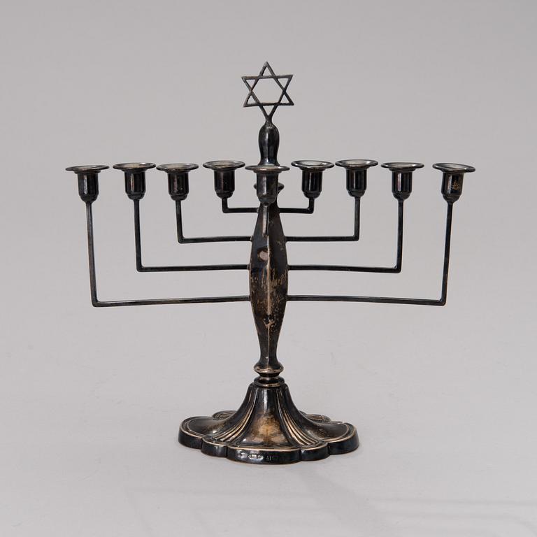 A chanukiah / menorah silver candelabrum for nine candles, mark of Britton, Gould & Co, Birmingham 1933.