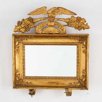 A first half of the 19th century mirror wall sconce.