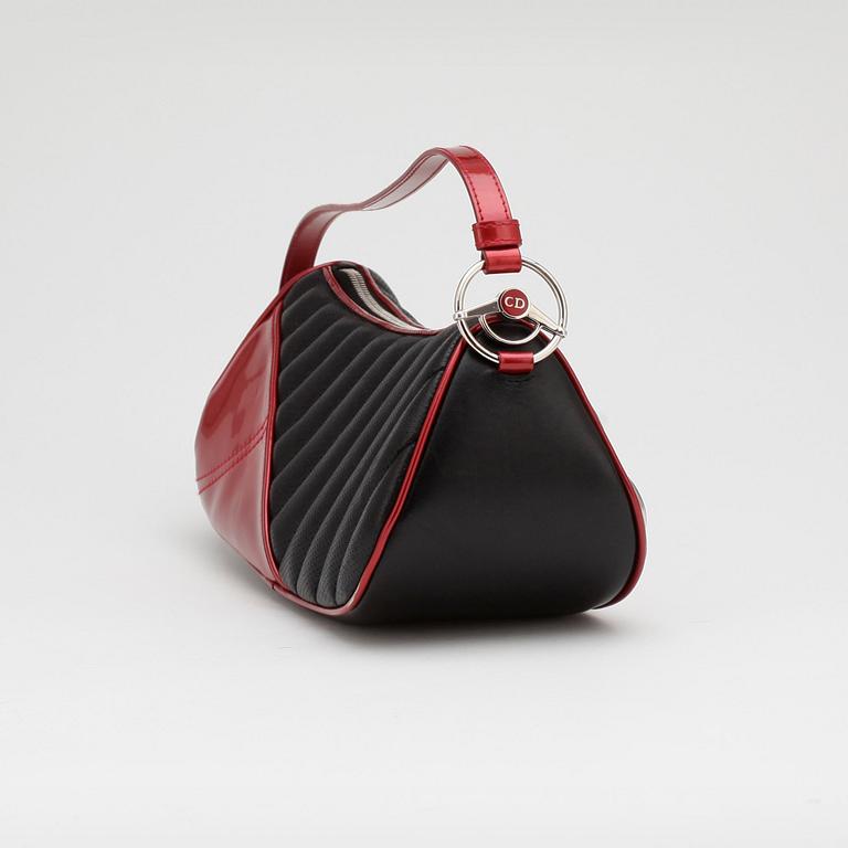 CHRISTIAN DIOR, a black leather shoulder bag with red patent details, "Montaigne Chris 1947".