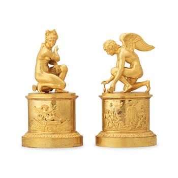 1325. A pair of early 19th century Empire gilt bronze table sculptures.