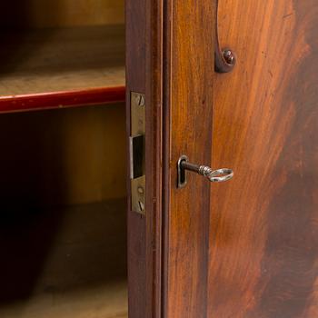 A 1830s/40s mahogany book case cabinet.