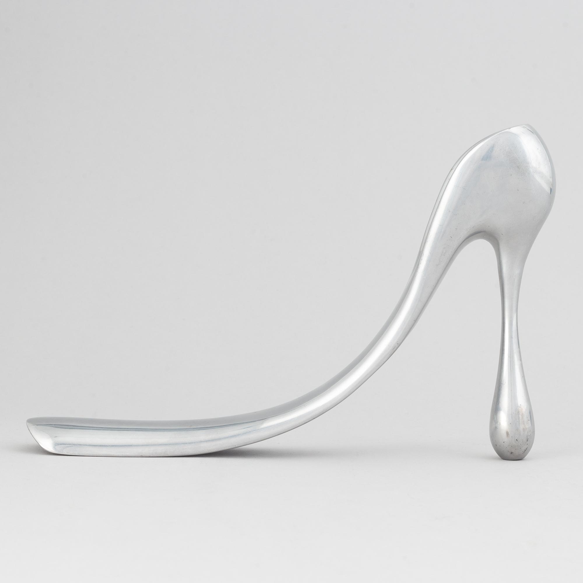 Manolo Blahnik, a metal shoe horn, 21st century.