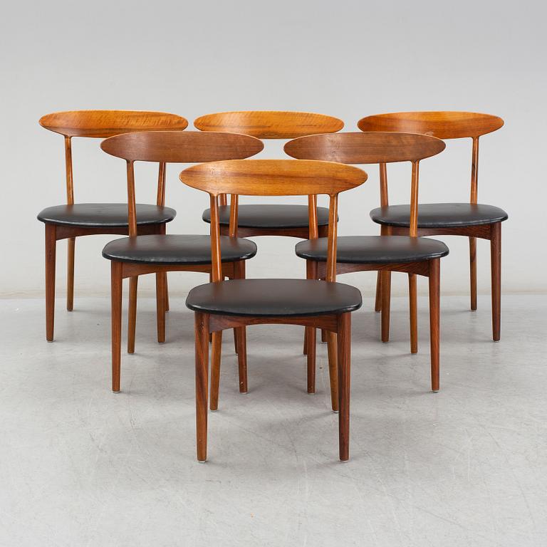 KURT ØSTERVIG, a teak dining suite with a round table and six chairs, Brande Möbelindustri, Denmark.