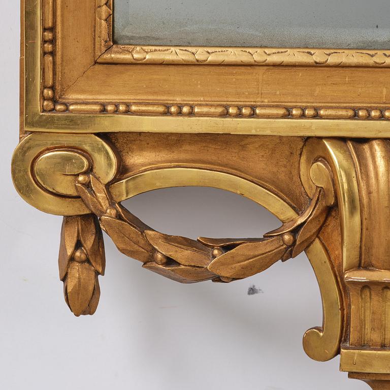 A Gustavian giltwood mirror, Stockholm, late 18th century.