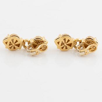 A pair of 18K gold earrings set with round brilliant-cut diamonds.