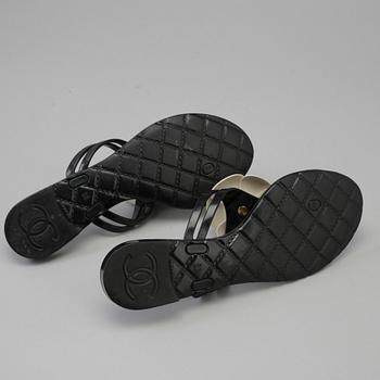 CHANEL, a pair of black plastic sandals. Size 38.