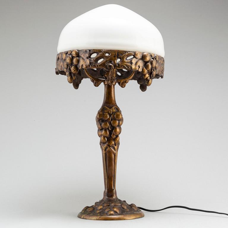 An early 20th Century art noveau bronze table lamp.