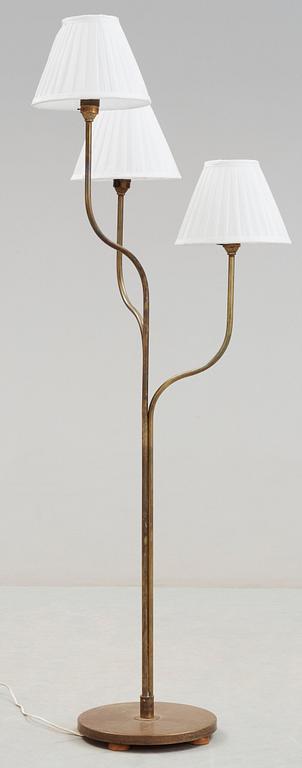 A brass floor-lamp attributed to G.A. Berg, Sweden 1940's.