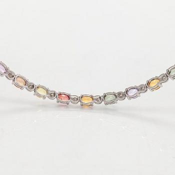 An 18K white gold necklace with multi-coloured sapphires and diamonds.