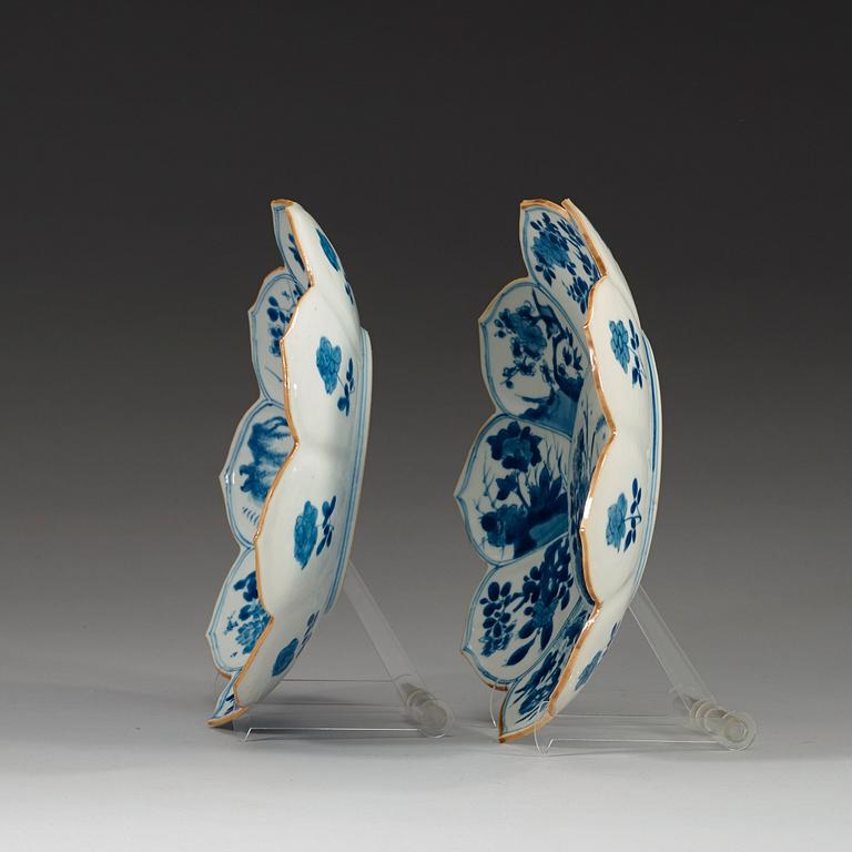 Two blue and white dishes of lotus shape decorated with flowers and insects, Qing dynasty, Kangxi (1662-1722).