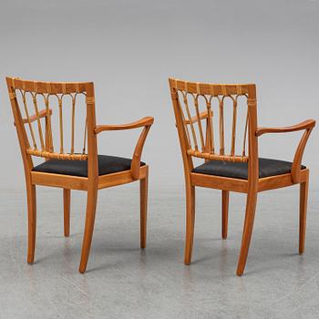 A pair of mahogany and rattan dining armchairs, Josef Frank, , model 1165, Svenskt Tenn, Stockholm.
