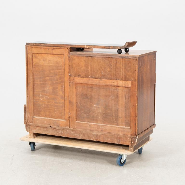 A walnut veneered Art Déco cabinet.