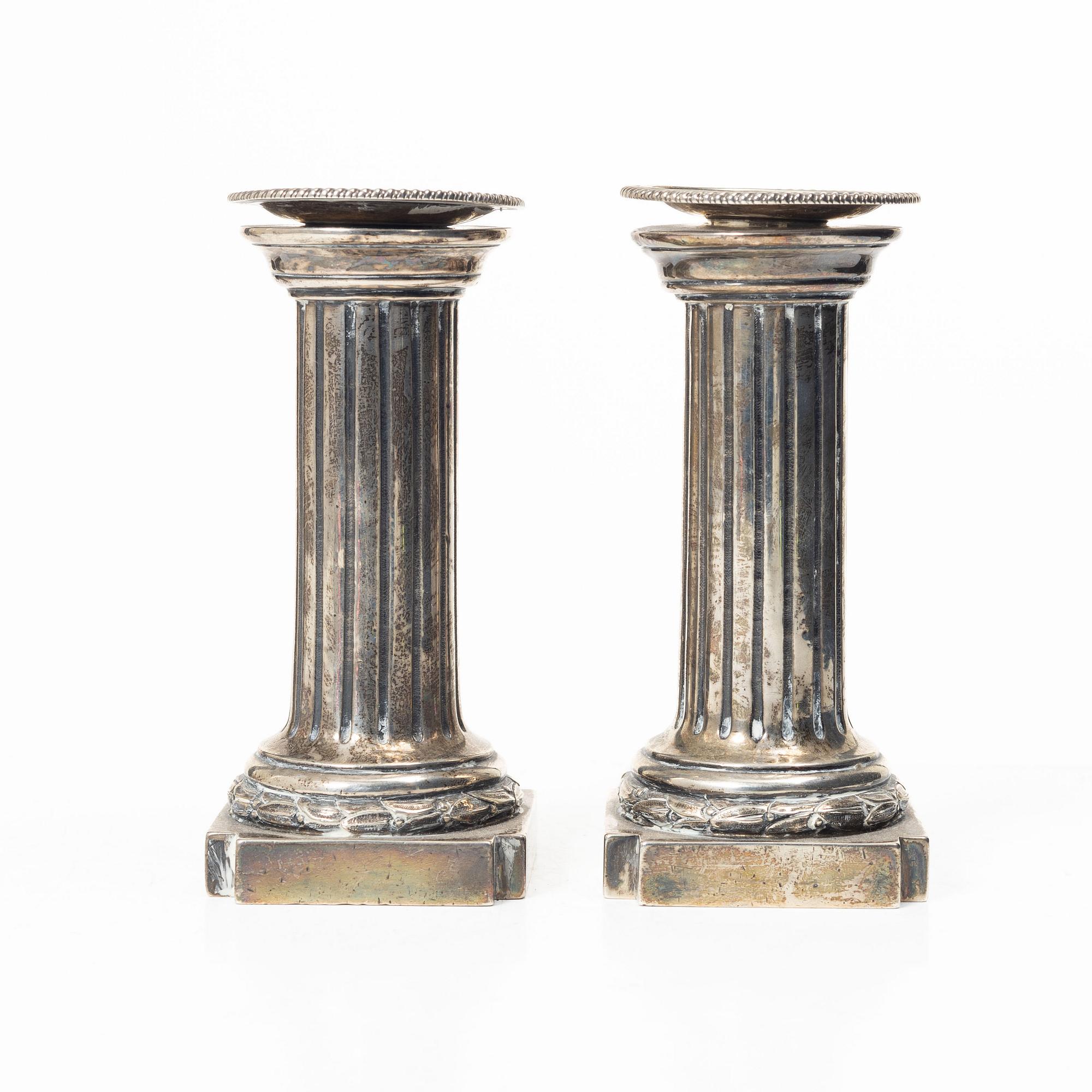 A pair of English silver candlesticks, mark of Arthur Sibley, London 1872.