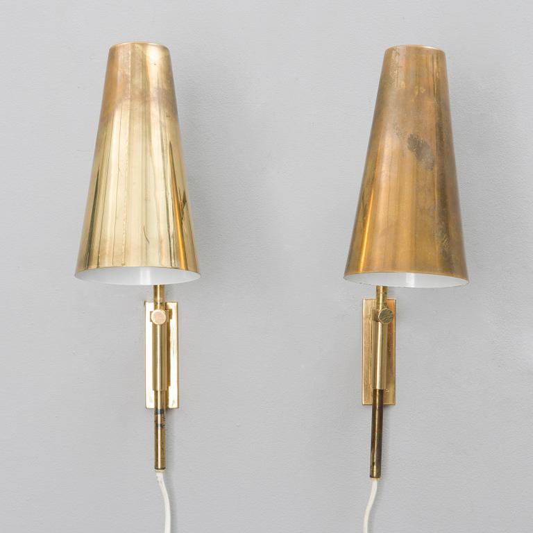 A pair of mid-20th century wall lights for Idman, Finland.