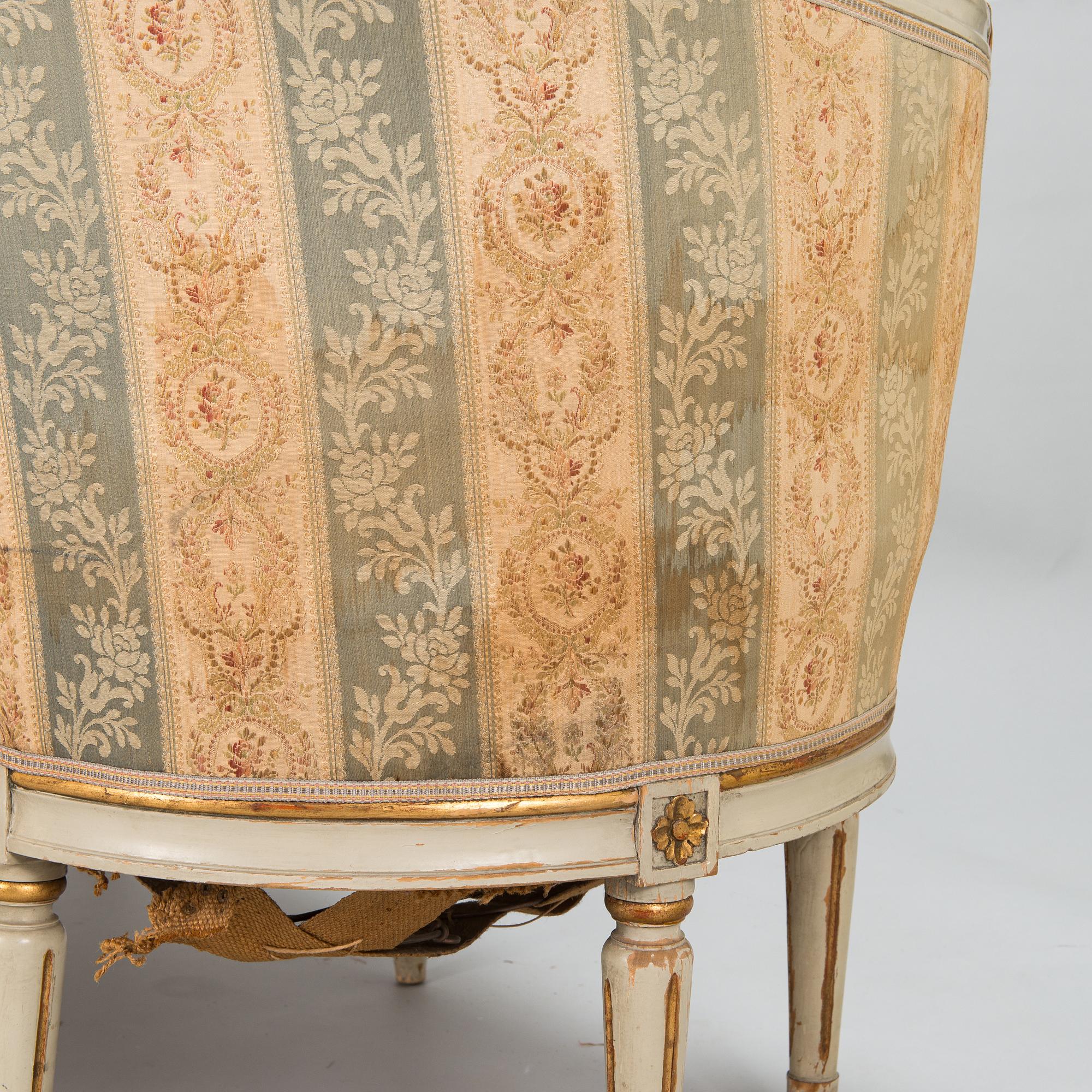 A Gustavian style sofa and table from early 20th century.