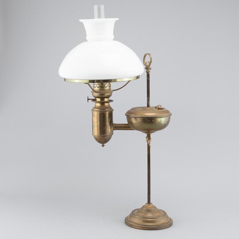 A table paraffin lamp, marked "Kosmos Brenner", around year 1900.