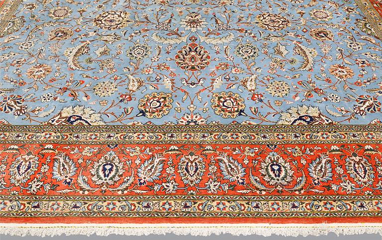 A Ghom carpet, part silk, approx. 480 x 350 cm.