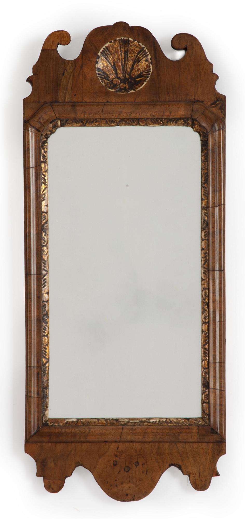A George II gilt-gesso and walnut mirror, first part of the 18th century.