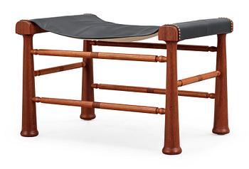 493. A Josef Frank mahogany and black leather stool, Svenskt Tenn, model 972.