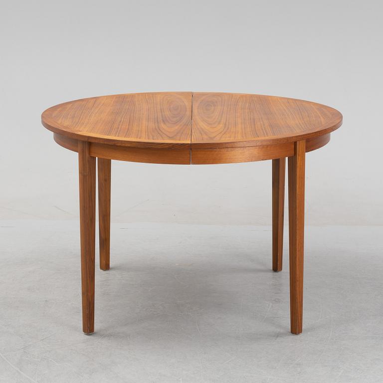 A teak veneered dining table, 1960's.