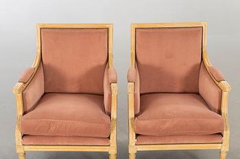 A pair of 20th century gustavian style armchairs.