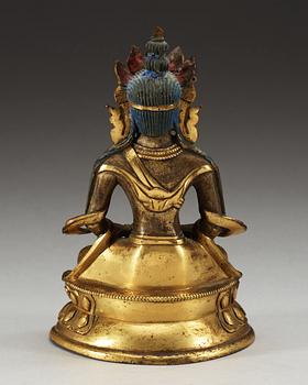 A partial-gilt bronze figure of Avalokiteshvara, Sino-Tibetan, 18th Century.