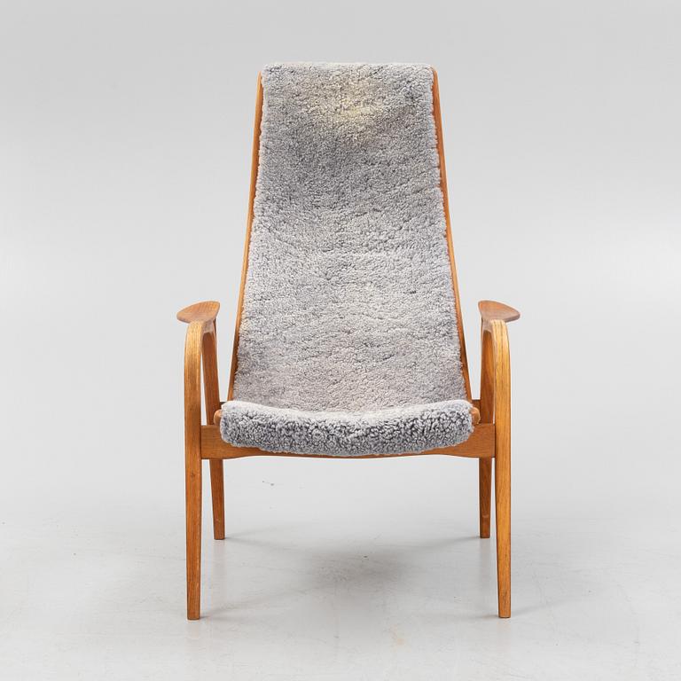 An Yngve Ekström Lamino sheepskin armchair and stool from Swedese.