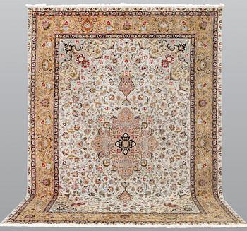 A part silk Tabriz carpet, so-called 50 Raj, approx. 348 x 252 cm.