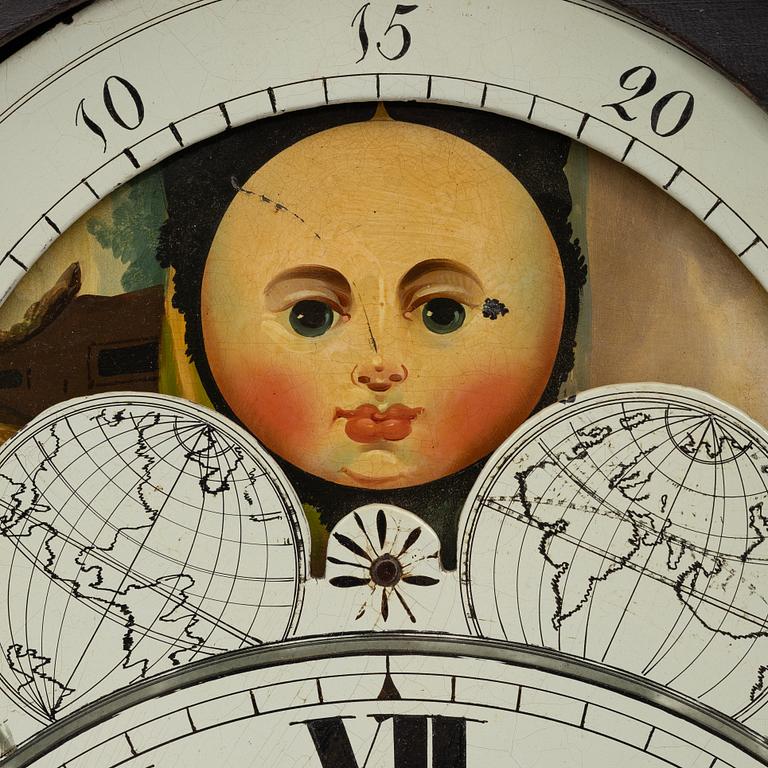 A long-case clock, England, 19th century.