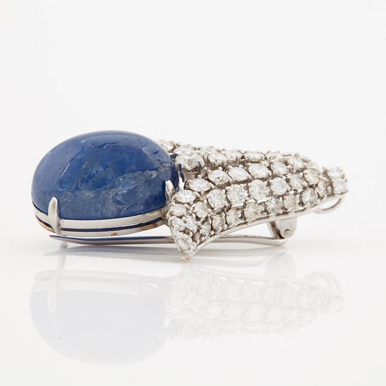 A cabochon cut Ceylon sapphire and brilliant cut diamond pendant/brooch.