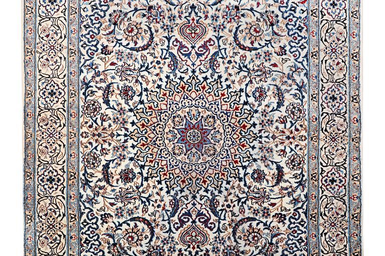 A Nain carpet, part silk, c. 293 x 199 cm.