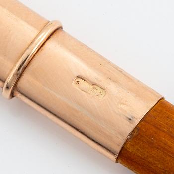 A 14K gold-mounted guilloché enamel pencil holder.