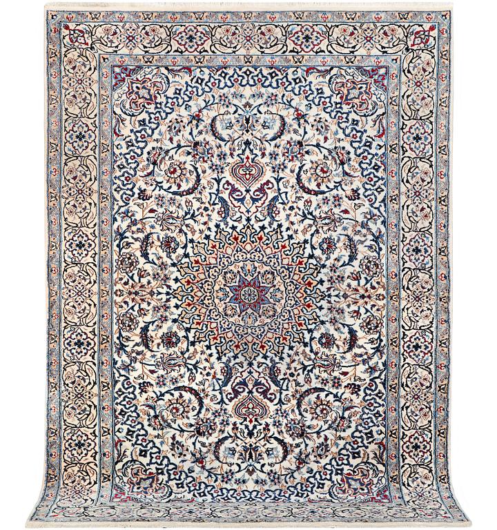 A Nain carpet, part silk, c. 293 x 199 cm.