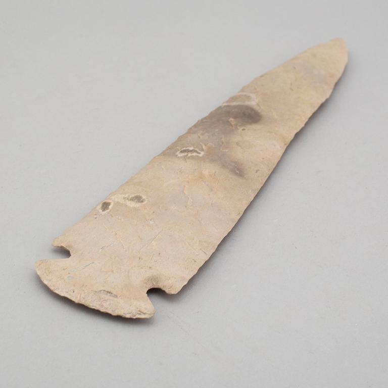 A grey flint spear head.