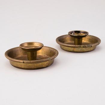 BERTEL GARDBERG, A pair of candleholders in brass, marked Gardberg.