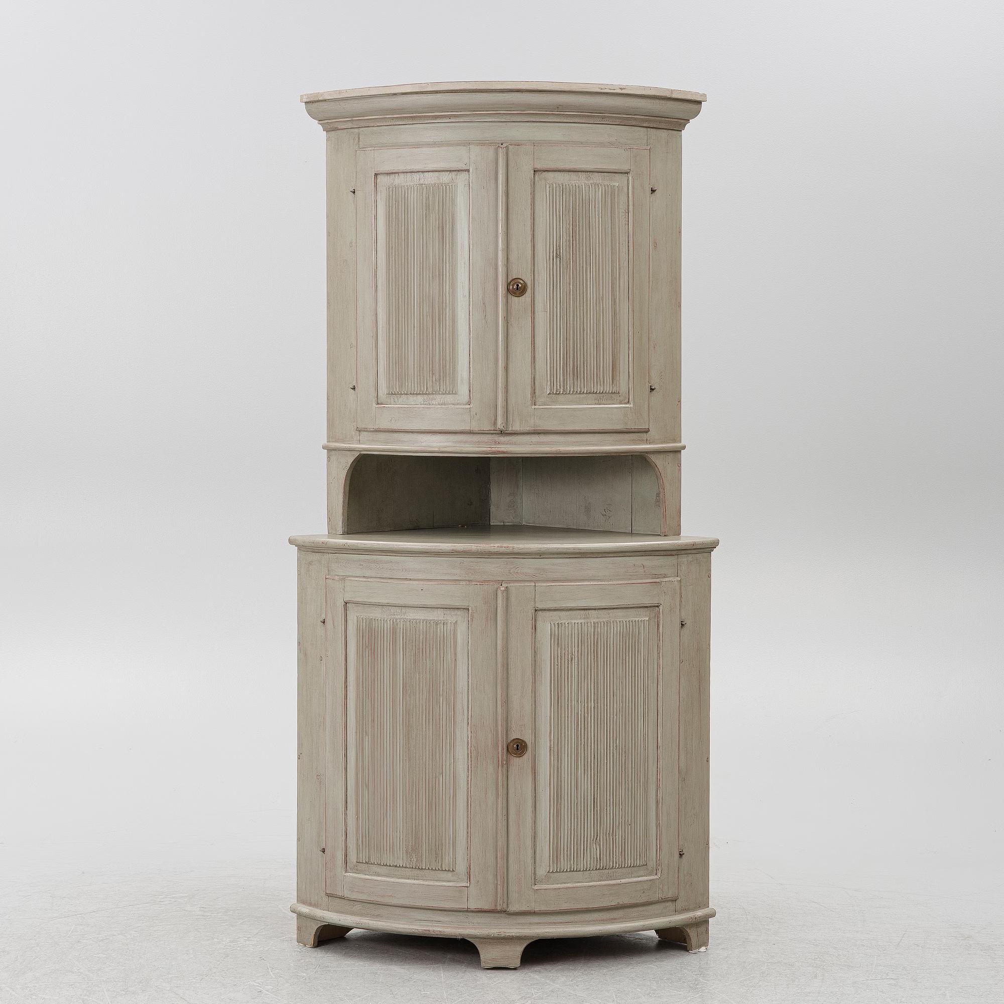 A Gustavian style corner cabinet, second half of the 20th Century.