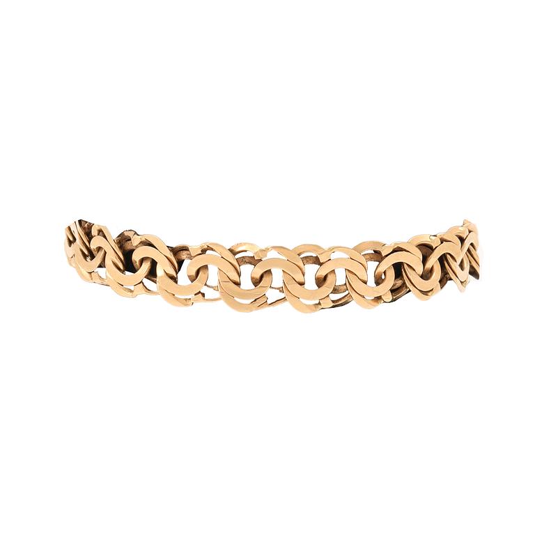 An 18K gold Bismarck bracelet.
