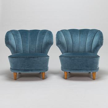A pair of mid-20th century armchairs.