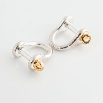 A pair of cufflinks by Ole Lynggaard.