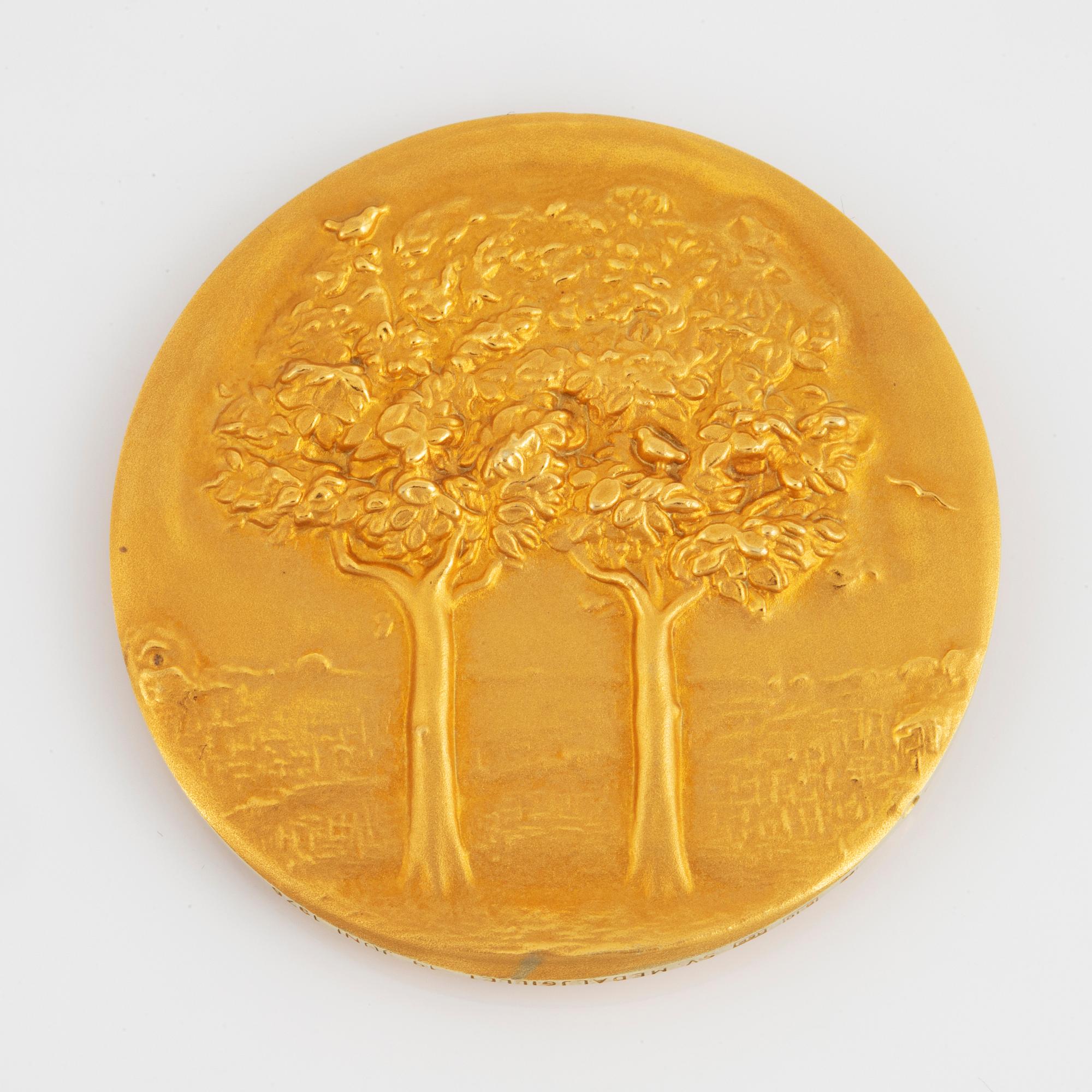 A Swedish commemorative medal in 18K gold.