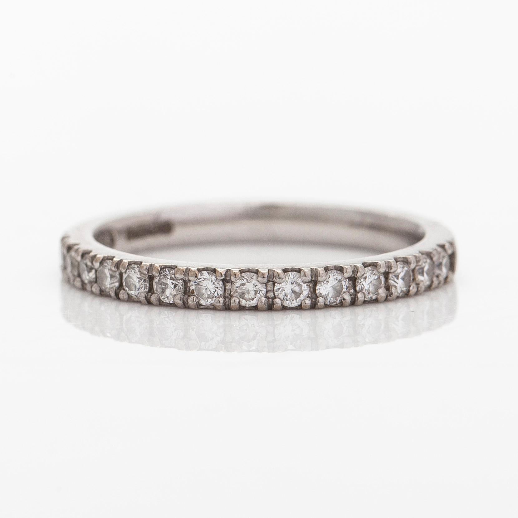 A platinum ring with brilliant cut diamonds.