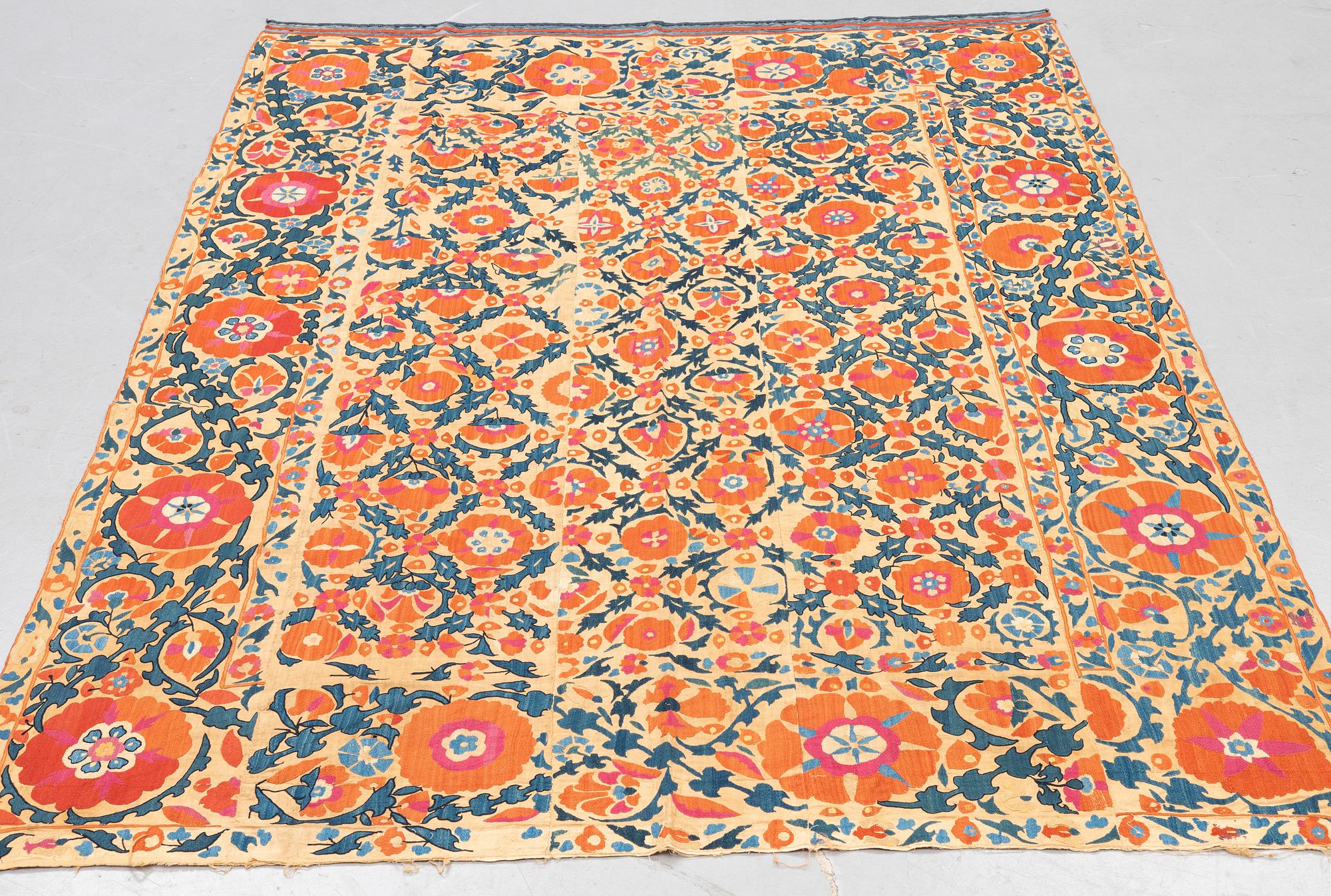 An embroidery, an antique suzani, ca 230 x 169 cm.