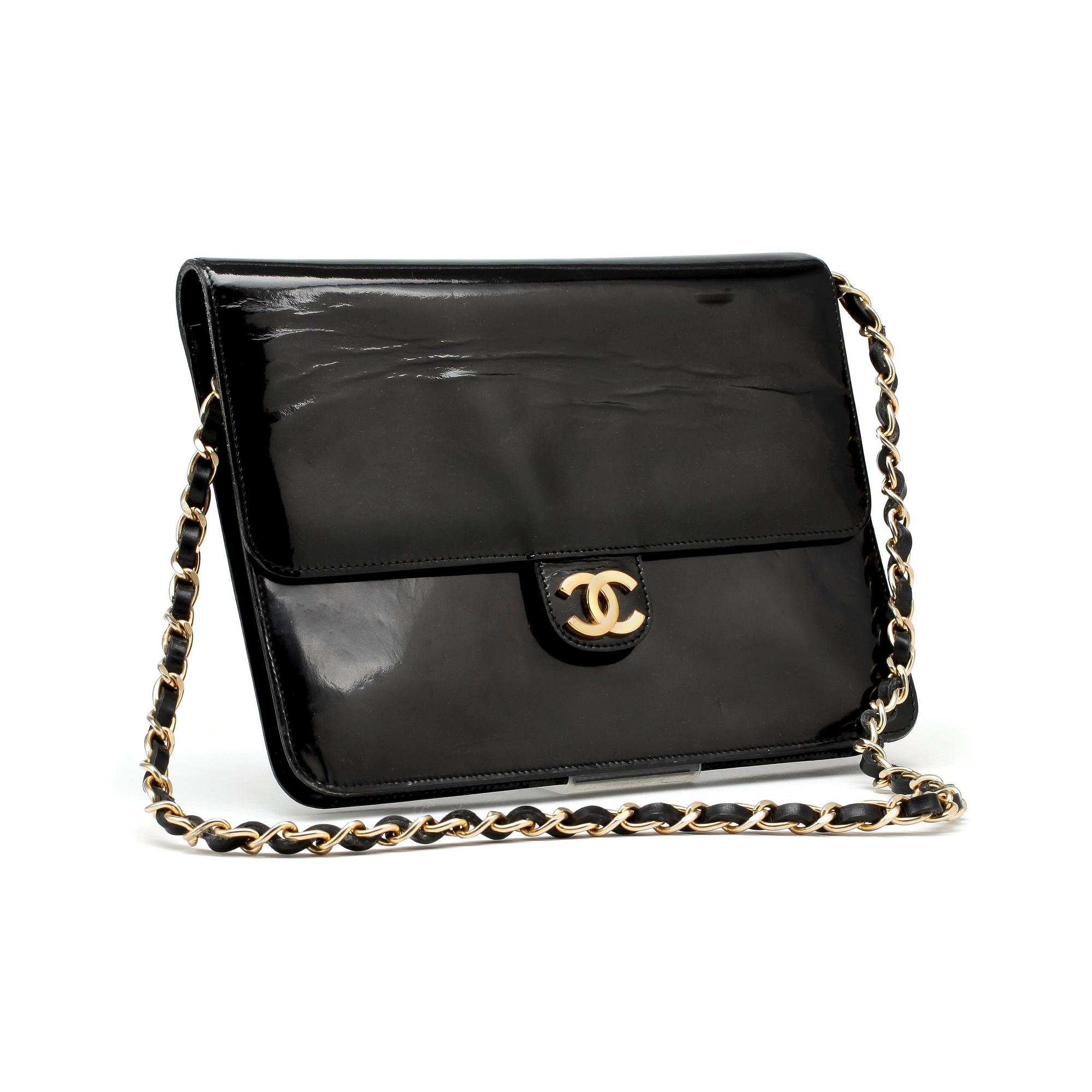 CHANEL, a black patent leather flap bag.