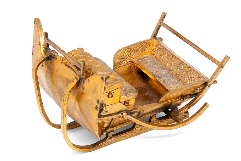 A SLEDGE, LETTER WEIGHT.